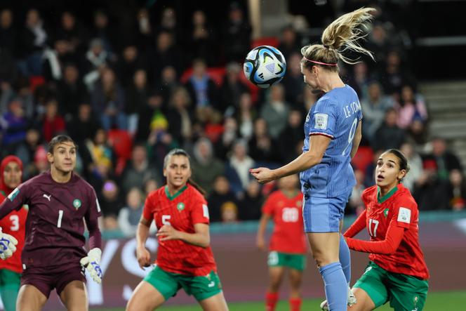 France's Eugénie Le Sommer heads the ball to score her team's fourth goal against Morocco in Adelaide, Australia, Tuesday, Aug. 8, 2023.