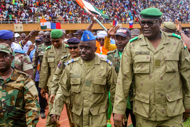 Members of the military council behind the coup in Niger, during a rally at the stadium in Niamey on August 6, 2023.