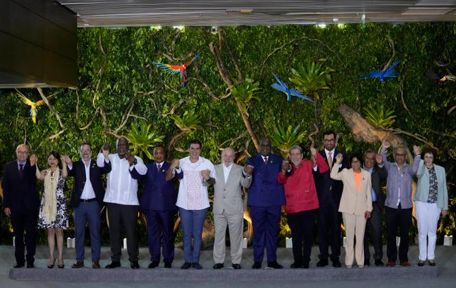Latin American, African, and European representatives pose around Brazilian President Luiz Inacio Lula da Silva during the Belem Summit, Brazil, August 9, 2023.