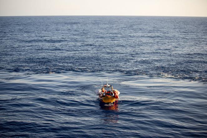 Migrants are carried by a Doctors Without Borders rescue team boat after being rescued in the Mediterranean Sea, Monday, August 7, 2023.