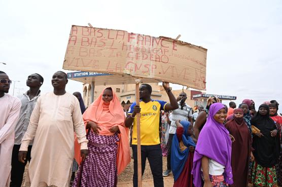 Supporters of the junta gather for a demonstration in Niamey on August 11, 2023 near a French air base in Niger.