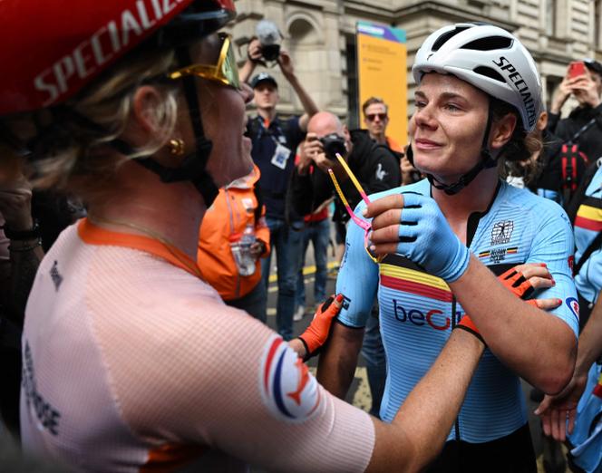 Belgium's Lotte Kopecky and the runner-up, the Netherlands' Demi Vollering, after women's road race at the Cycling World Championships in Glasgow, Scotland on August 13, 2023.