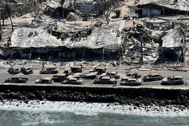 Burned-out cars on the road in Lahaina, August 11, 2023.