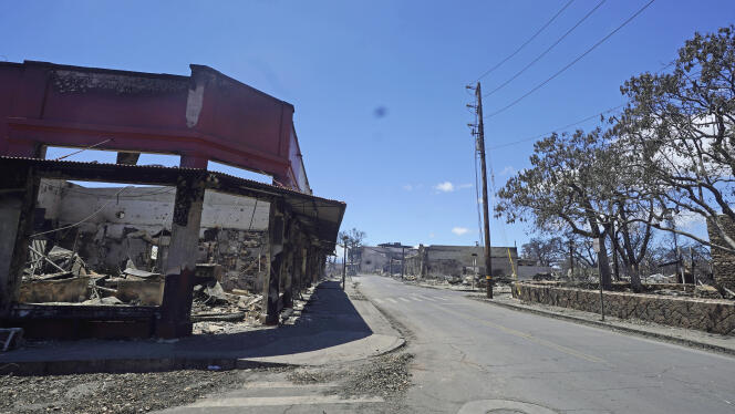Damaged buildings line a street in Lahaina, Hawaii on August 12, 2023.