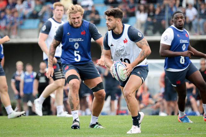 France's fly-half Romain Ntamack (R) and lock Bastien Chalureau take part in a training session, as part of the French team's preparations ahead of the 2023 Rugby World Cup in France, in Marcoussis, August 2, 2023. 