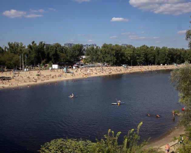 Ukrainians enjoy water sports on the Dnieper River in Kiev, Ukraine, August 13, 2023.