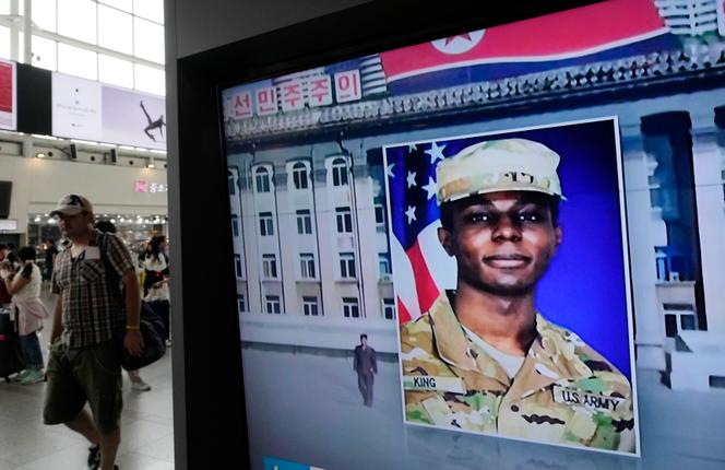 A TV screen shows a file image of American soldier Travis King during a news program at the Seoul Railway Station in Seoul, South Korea, Wednesday, August 16, 2023. 