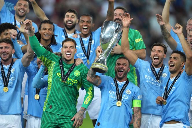 Manchester City players celebrate after winning the UEFA Super Cup Final soccer match between Manchester City and Sevilla at Georgios Karaiskakis stadium in Piraeus port, near Athens, Greece, Wednesday, August 16, 2023.