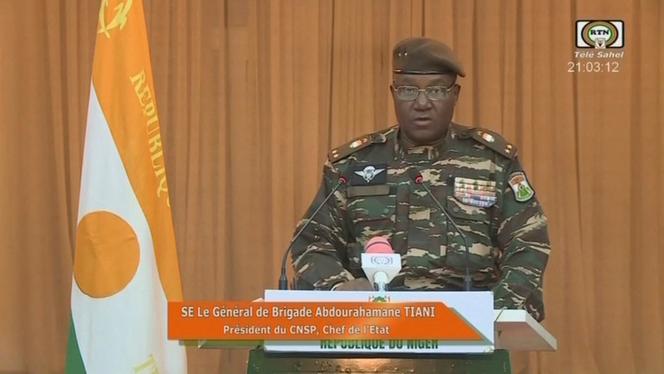 This video frame grab image obtained by AFP from ORTN - Télé Sahel on August 19, 2023 shows Niger's new military ruler General Abdourahamane Tiani, reading a statement on national television.