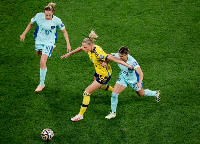 Sweden's Fridolina Rolfo in action with Australia's Emily van Egmond and Kyra Cooney in the Women's World Cup third place playoff, August 19, 2023.