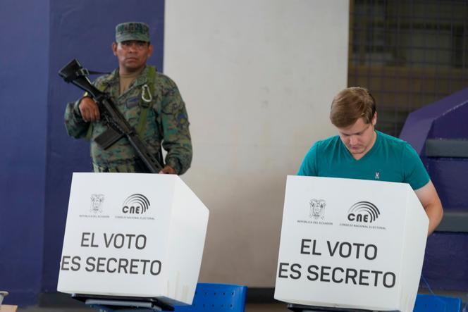 A man votes during a presidential election in Guayaquil, Ecuador, Sunday, Aug. 20, 2023. The election was called after President Guillermo Lasso dissolved the National Assembly by decree in May to avoid being impeached. (AP Photo/Martin Mejia)