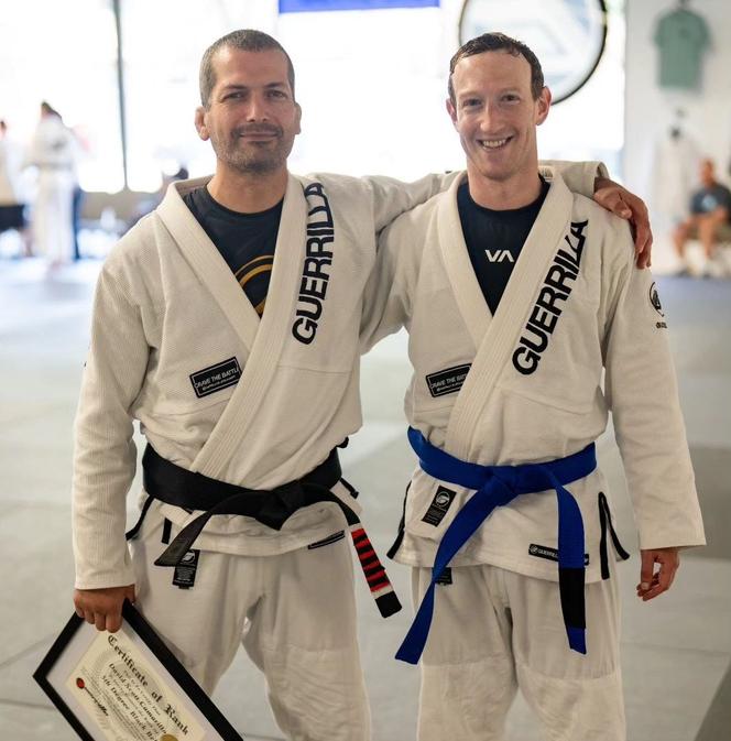 Mark Zuckerberg (right), posing with his Brazilian jiu-jitsu teacher.