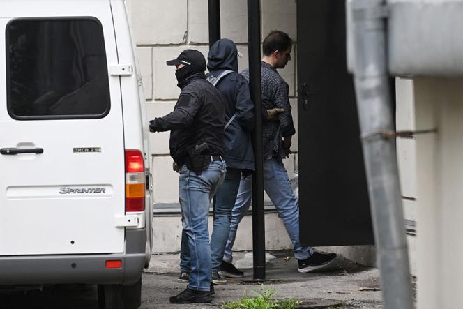 US journalist Evan Gershkovich is escorted outside the Lefortovsky Court in Moscow on August 24, 2023.