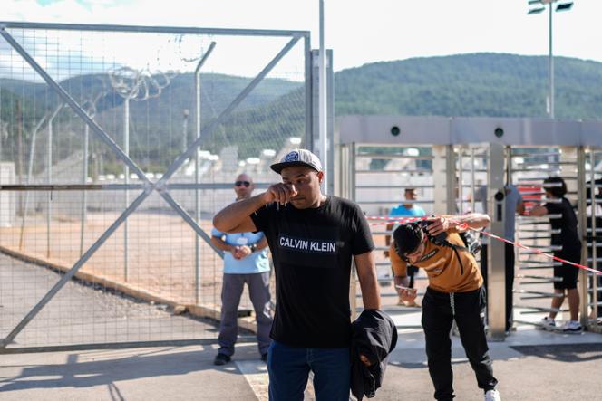 A visitor leaving the migrant camp at Malakasa, north of Athens, on June 19, 2023. 