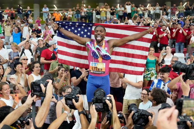 Noah Lyles, of the United States, celebrates after winning the gold medal in the Men's 200-meters final during the World Athletics Championships in Budapest, Hungary, Friday, August 25, 2023.