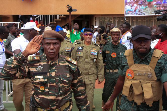 Nigeriens junta leaders salute in the capital Niamey, Niger August 26, 2023. 