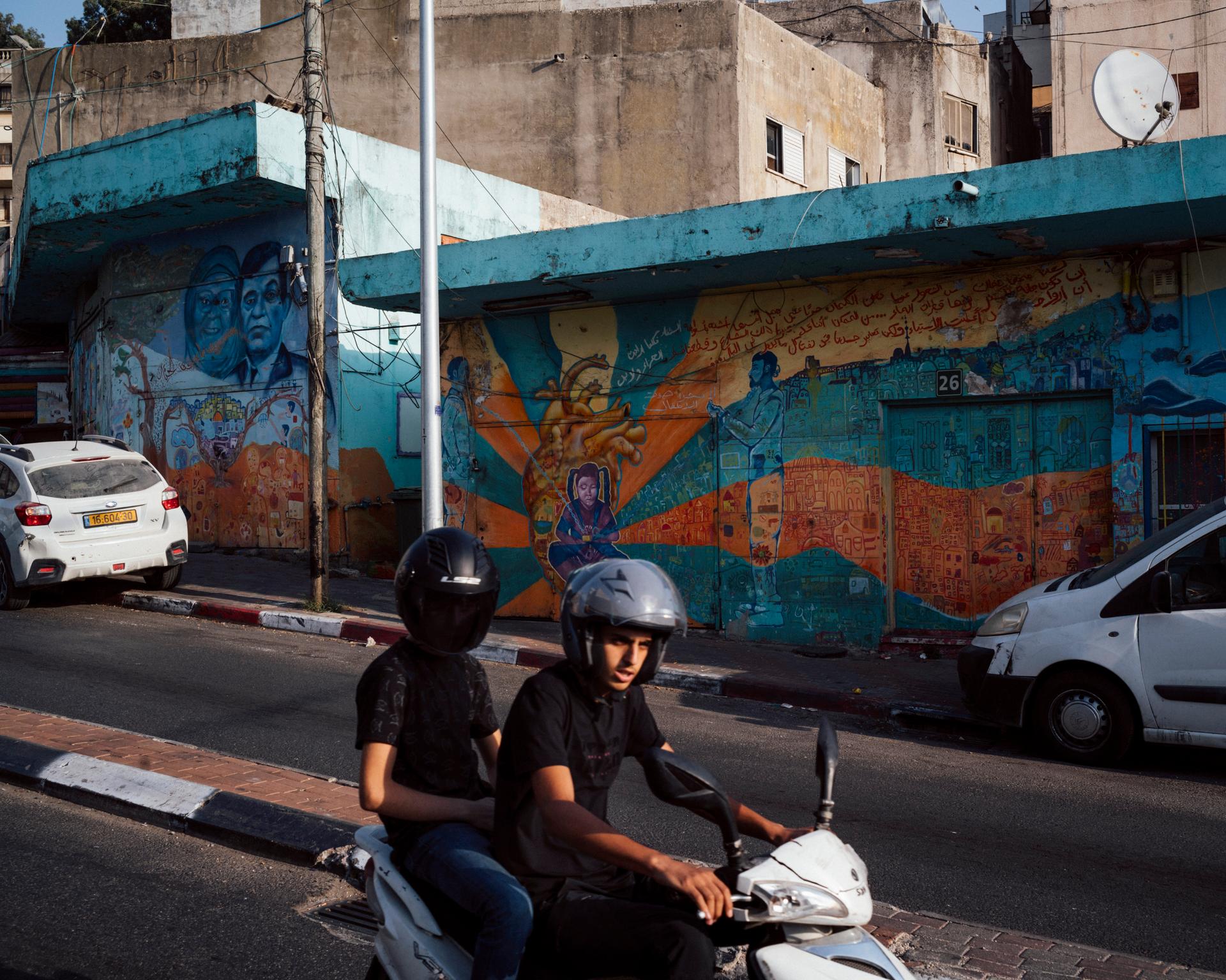 On a street in Umm al-Fahm, Israel, on August 15, 2023. The murals are the work of Kifah Ghbarieh, an artist who lost seven members of her family during violence in the city's Arab-Israeli community.