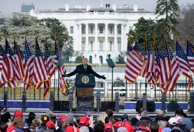 With the White House in the background, President Donald Trump speaks at a rally in Washington, January 6, 2021, before his supporters storm the US Capitol.