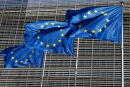 European Union flags flutter outside the EU Commission headquarters in Brussels, Belgium June 17, 2022. REUTERS/Yves Herman