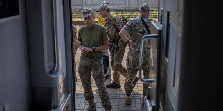 Ukrainian soldiers on the platform of the Sloviansk station on a train from Kiev to Kramatorsk (25km from the front), in the Donbass region of eastern Ukraine, August 24, 2023.