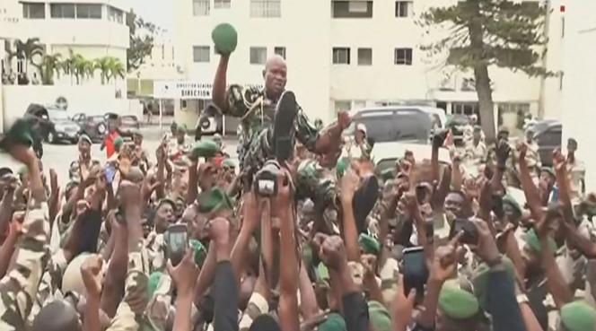 Image extracted from a video broadcast on the Gabon 24 television shows General Brice Oligui Nguema being carried in triumph by men of the Republican Guard, in Libreville, on August 30, 2023.