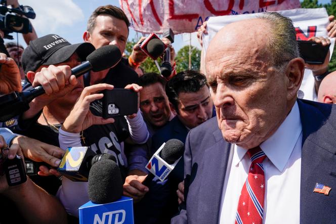Rudy Giuliani speaks outside the Fulton County jail, Wednesday, August 23, 2023, in Atlanta.