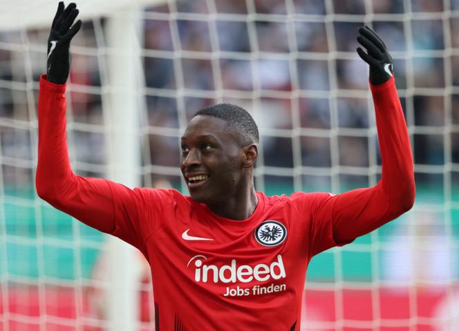 Frankfurt's French forward Randal Kolo Muani celebrates scoring the 2-0 goal with his team-mates during the German Cup (DFB Pokal) quarter-final football match Eintracht Frankfurt v Union Berlin in Frankfurt, western Germany on April 4, 2023.