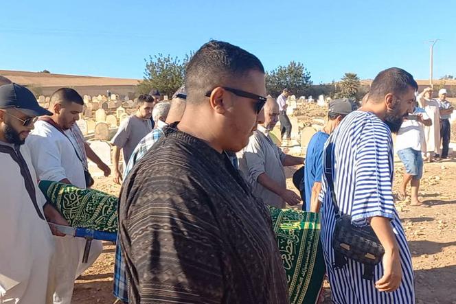 Relatives carry the body of Bilal Kissi, shot dead by the Algerian coastguard when he and a fellow jet skier strayed across the maritime border between Algeria and Morocco, during his funeral in the city of Saidia in northeastern Morocco on August 31, 2023. 