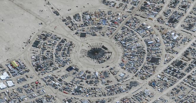 This handout satellite image courtesy of Maxar Technology shows an overview of the annual Burning Man festival underway in Nevada’s Black Rock desert on August 29, 2023. 