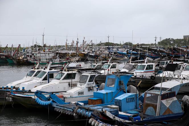 Fishing boats are anchored at a port in Yilan as Typhoon Haikui makes landfall in eastern Taiwan on September 3, 2023. 