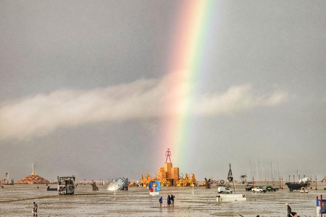 A rainbow appears to land on the Burning Man effigy in Nevada's Black Rock desert, on September 1, 2023.