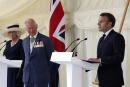 FILE - Britain's Prince Charles and Camilla, Duchess of Cornwall look on as French President Emmanuel Macron, right, makes a speech following laying a wreath at a ceremony at Carlton Gardens in London, Thursday June 18, 2020. King Charles III will travel to France later in Sept. 2023 finally proceeding with a State Visit that was postponed in March due to fears that protesters demonstrating against President Emanuel Macron’s economic policies would disrupt the pageantry. (Jonathan Brady/Pool via AP, File)