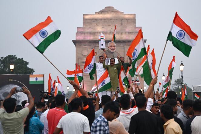 Indians celebrate the successful landing of the Chandrayaan-3 spacecraft on the Moon's South Pole in New Delhi on August 23, 2023.