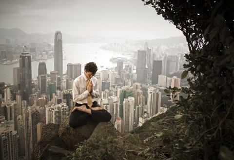 HONG KONG, CHINA - 2005/10/08: A yoga teacher performs a yoga pose at the Peak, overlooking Central, in Hong Kong.
MODEL RELEASED. (Photo by Gerhard Joren/LightRocket via Getty Images)