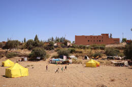 Children play near tents, in the aftermath of a deadly earthquake, in Amizmiz, Morocco, September 10, 2023. REUTERS/Nacho Doce