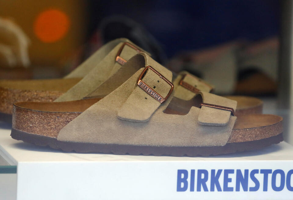 FILE PHOTO: A pair of shoes is pictured in a window of a Birkenstock footwear store in Berlin, Germany, January 21, 2021. REUTERS/Fabrizio Bensch/File Photo