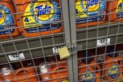 Packets of laundry detergent under lock and key in a New York store. July 3, 2023.