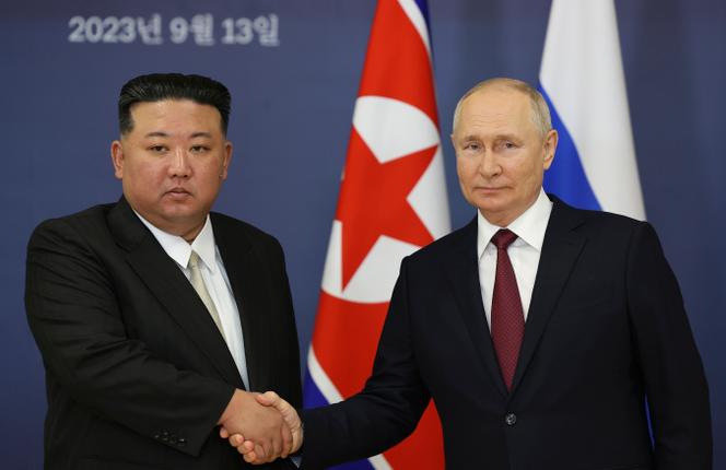 Russian President Vladimir Putin, right, and North Korea's leader Kim Jong Un shake hands during their meeting at the Vostochny cosmodrome outside the city of Tsiolkovsky, on September 13, 2023.