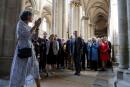 French President Emmanuel Macron (C) and by his wife Brigitte Macron (4th R) visit the gothic La Collegiale Notre-Dame church as part of a trip focused on the European Heritage Days in Semur-en-Auxois in Burgundy, central-eastern France, on September 15, 2023. (Photo by Ludovic MARIN / POOL / AFP)