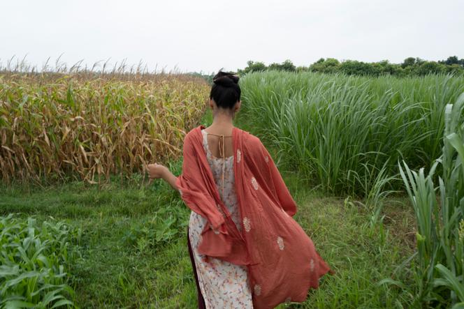 Punyma, a 17-year-old girl living near the town of Natore, Bangladesh, in a field behind her house. The girl narrowly missed being married off at the age of 13. Near Natore, Natore district, Bangladesh, June 6, 2023.