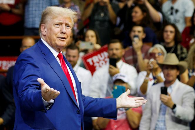 Donald Trump speaks on the stage at a South Dakota Republican party rally in Rapid City, South Dakota, September 8, 2023. 
