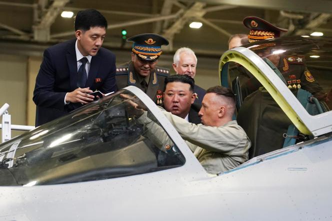 In this photo released by the Khabarovsky Krai region government, North Korean leader Kim Jong Un, center, looks at a military jet cockpit while visiting a Russian aircraft plant that builds fighter jets in Komsomolsk-on-Amur, about 6,200 kilometers east of Moscow, Russia, September 15, 2023.