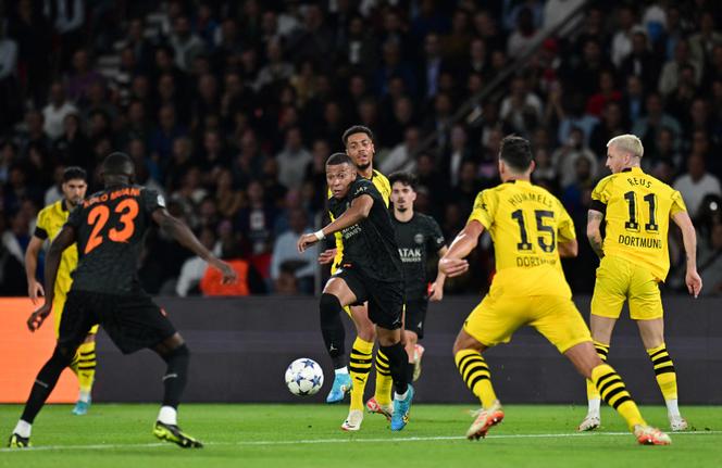Paris Saint-Germain's French forward #07 Kylian Mbappe runs with the ball during the UEFA Champions League 1st round Group F football match between Paris Saint-Germain (PSG) and Borussia Dortmund (BVB) at the Parc des Princes stadium in Paris on September 19, 2023.