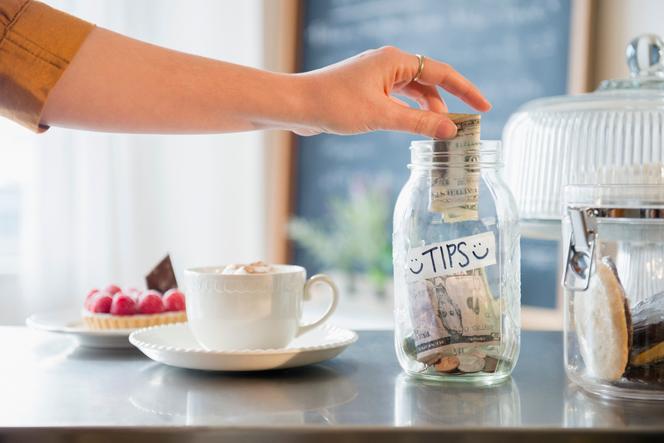 In the United States, the traditional tip jar is being replaced by electronic systems.