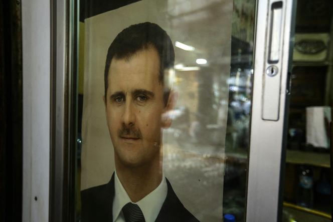 A poster bearing a picture of Syria's President Bashar al-Assad in Damascus, on September 20, 2023. 