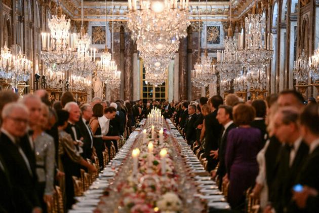 Guests attend the state banquet at the Palace of Versailles, west of Paris.