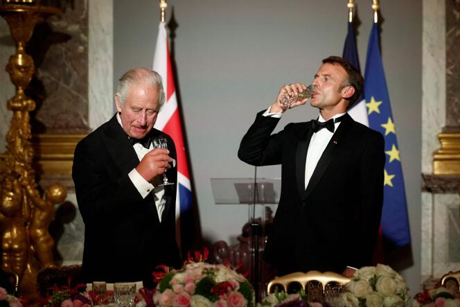 Britain's King Charles III (L) and French President Emmanuel Macron toast during a state banquet at the Palace of Versailles, west of Paris, on September 20, 2023, on the first day of a British royal state visit to France.