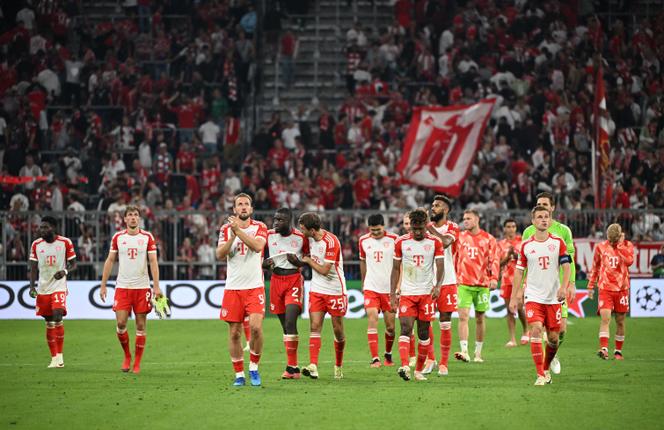 Bayern Munich's Harry Kane with teammates celebrate after the match at the Allianz Arena, Munich, Germany - September 20, 2023.
