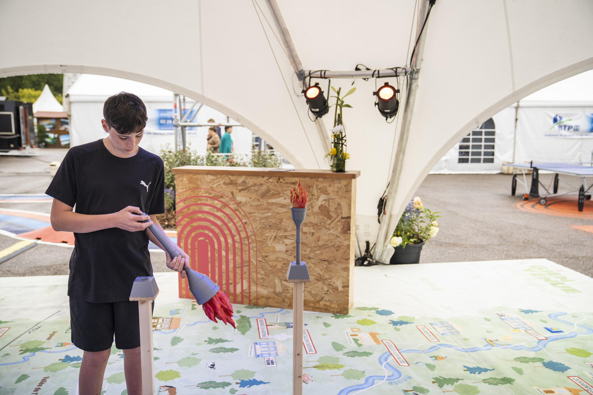 A large map of the Meuse allowing Olympic flames to be placed in 3D printing on the cities where the flame will p, on the stand of the Meuse department, at the Verdun National Fair, September 16, 2023.