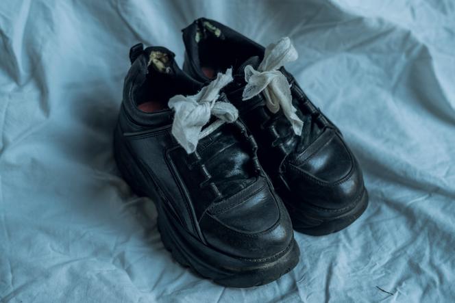 The shoes of Maria Alyokhina, 33, member of the Russian protest group Pussy Riot. Wipes replace her laces, which were confiscated while she was serving a two-year prison sentence. In May 2022, having been subjected for months to a regime of restrictions on her freedoms for having called for a protest against the arrest of Alexei Navalny, she managed to escape the police and find refuge in Vilnius, Lithuania. Photo taken on May 2, 2022.